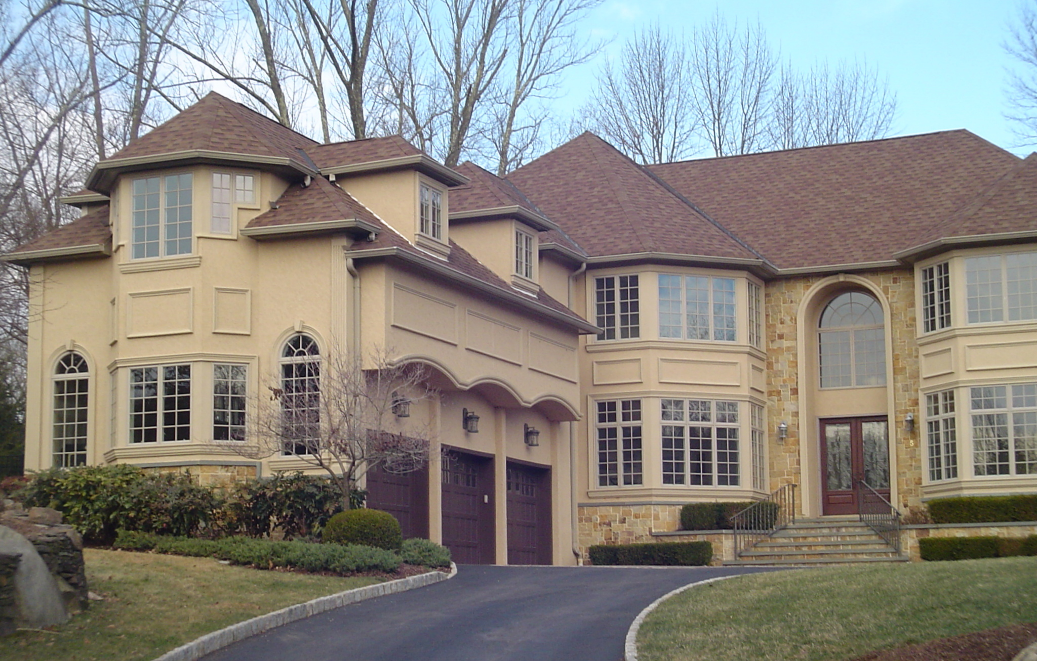 Hard coat stucco with custom trim and stone in Somerset County