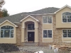 Stucco and stone front with custom trim detail