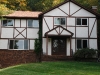 Failing stucco and tudor board in Morris County - before.